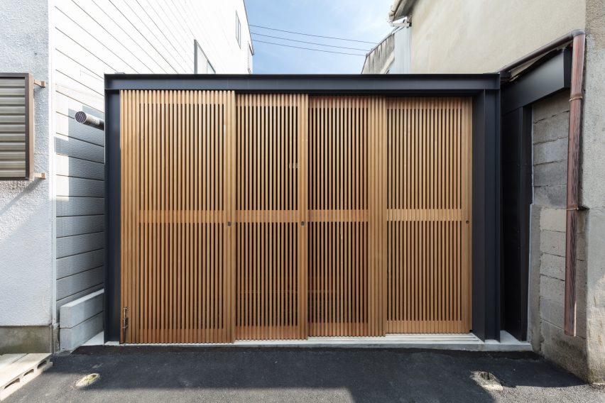 Shutters enclosing a small Japanese house