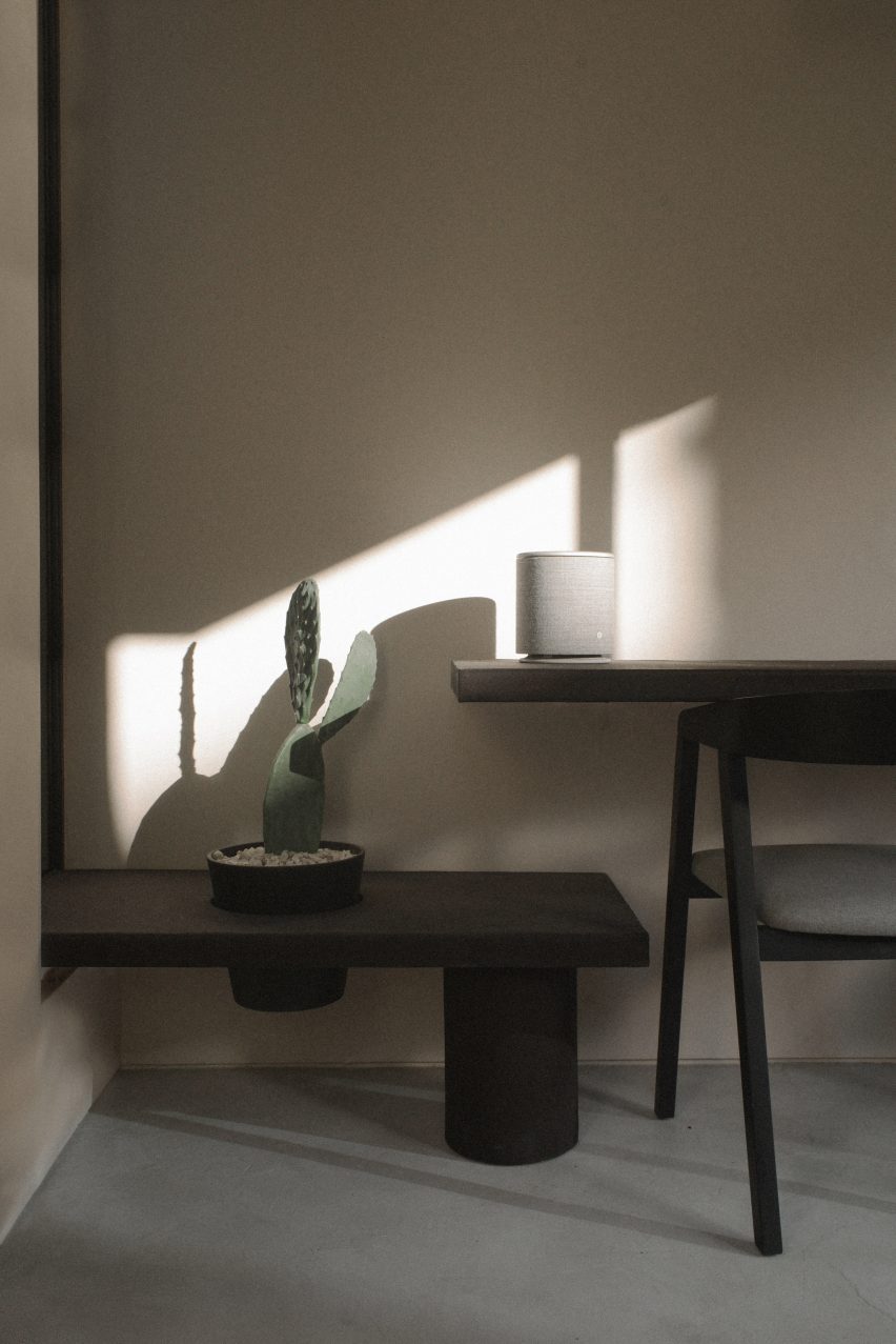 A minimalist workspace with black furniture
