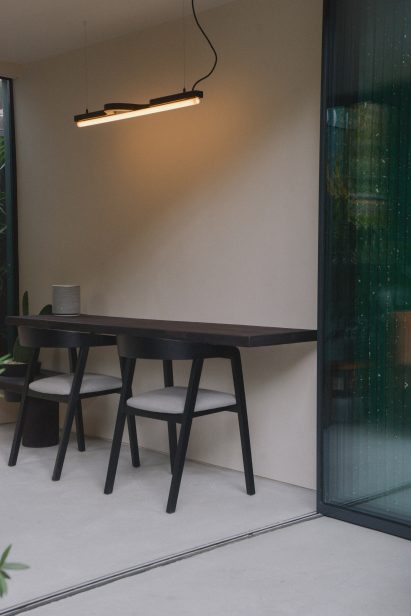 A stained-cork desk spans one wall