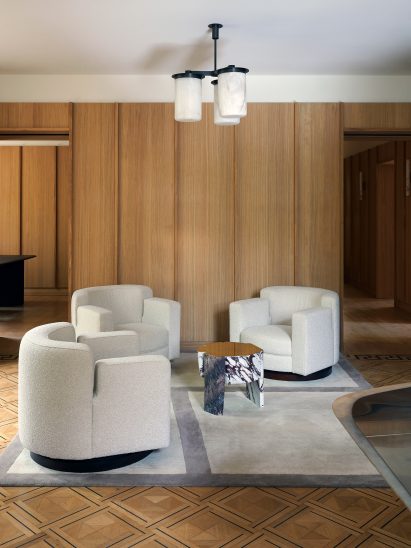 White vintage chairs and French oak panelling in Amsterdam office by Framework
