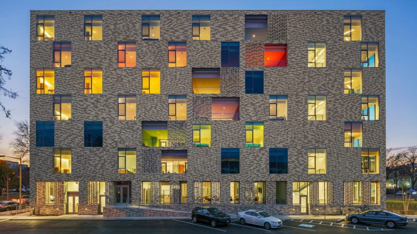 A brick facade with large glazed windows