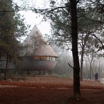 A guesthouse with a conical roof