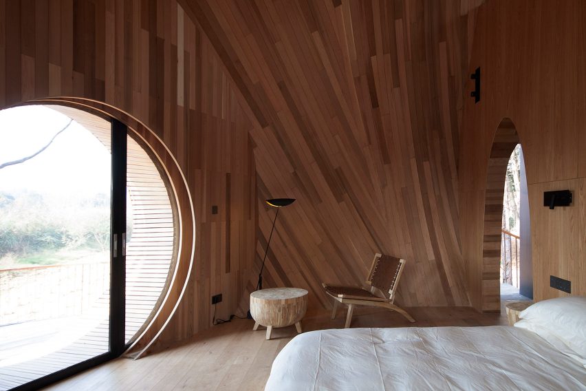 A wood-lined bedroom