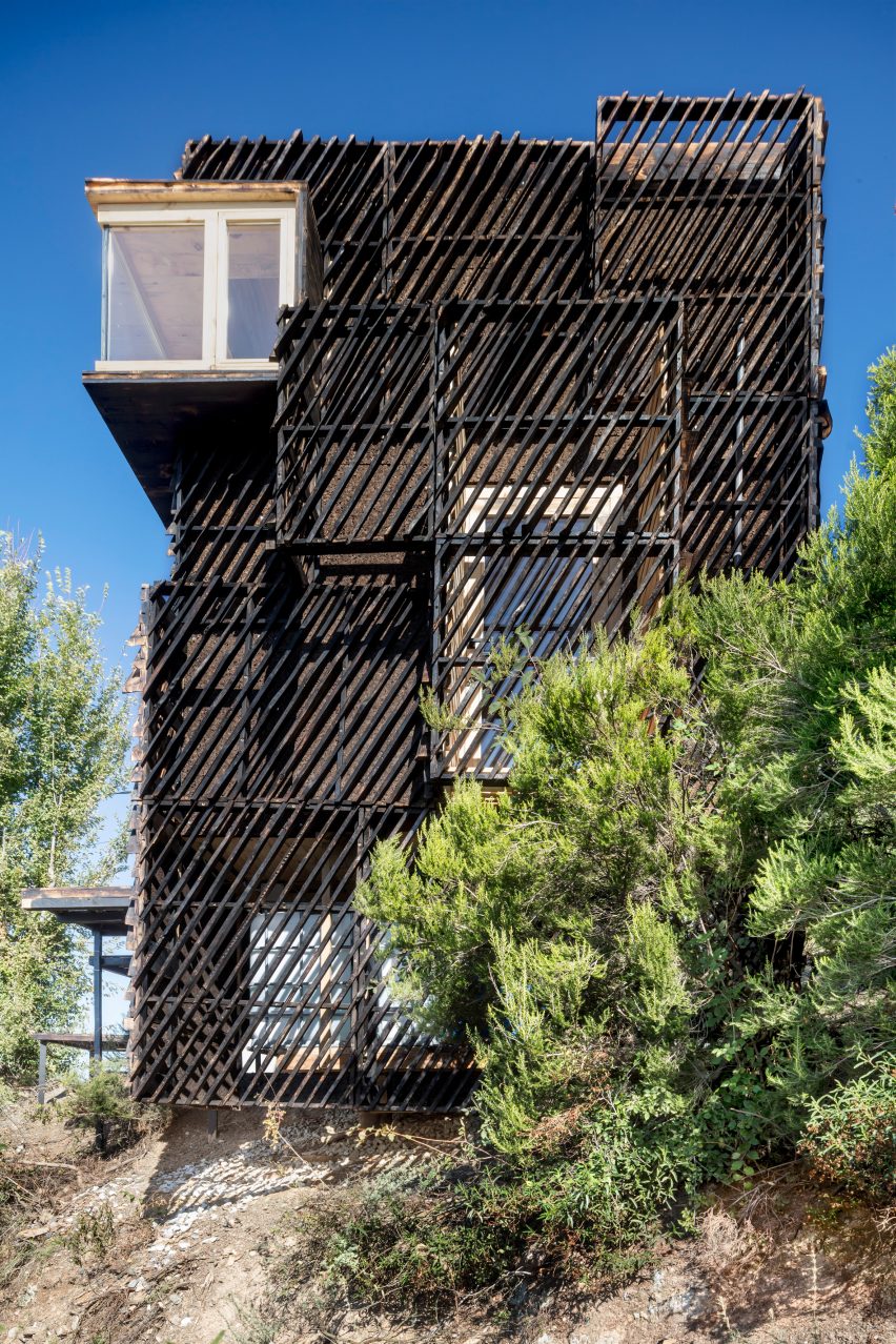 A cabin clad with slatted wood