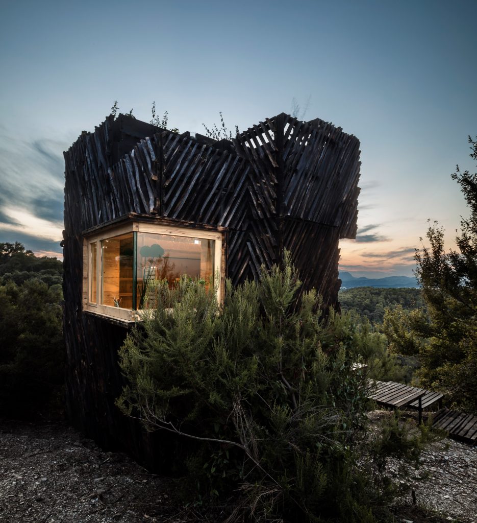 A cabin with a slatted exterior