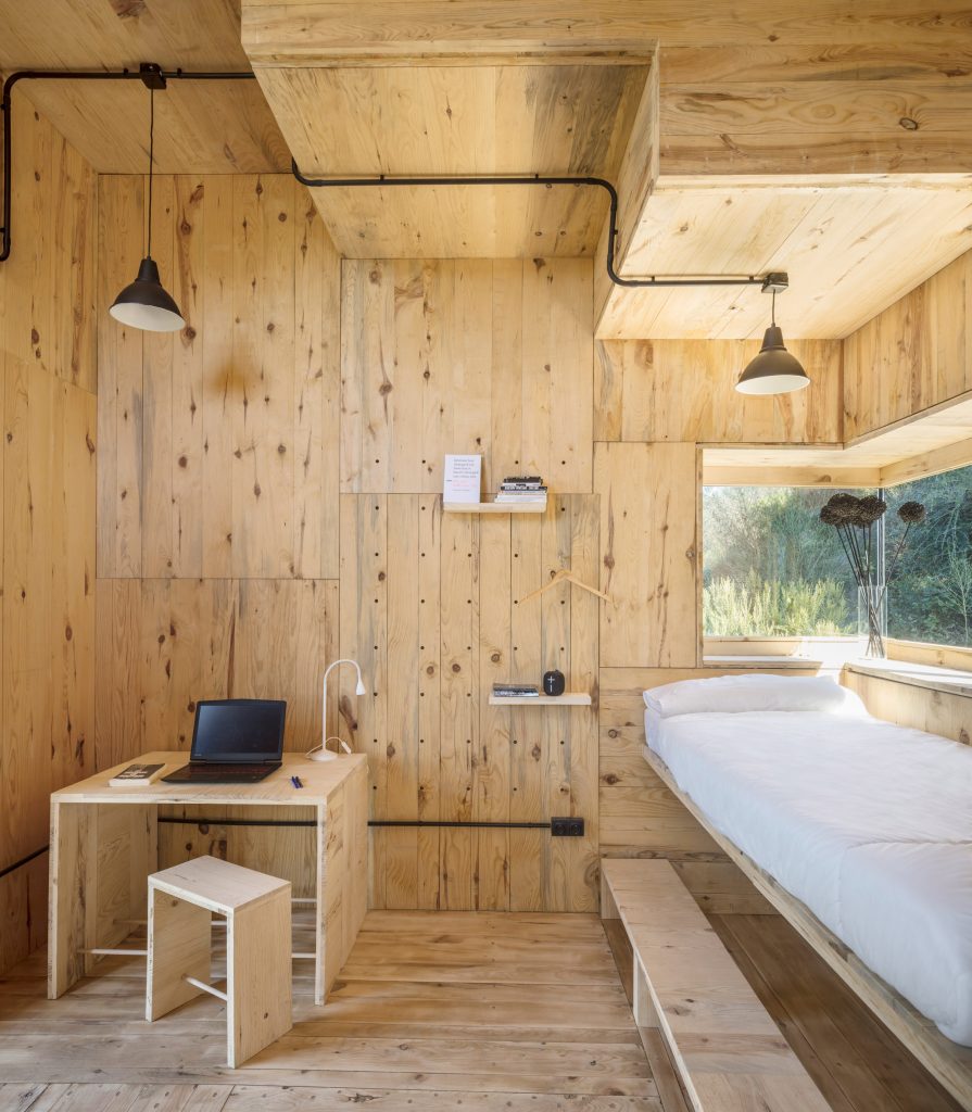 The interiors of a pine-lined cabin