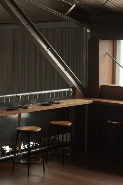 Mezzanine counter seating in restaurant interior by Pattern