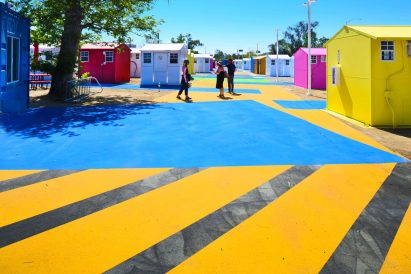 Brightly coloured asphalt in a homeless housing project in LA