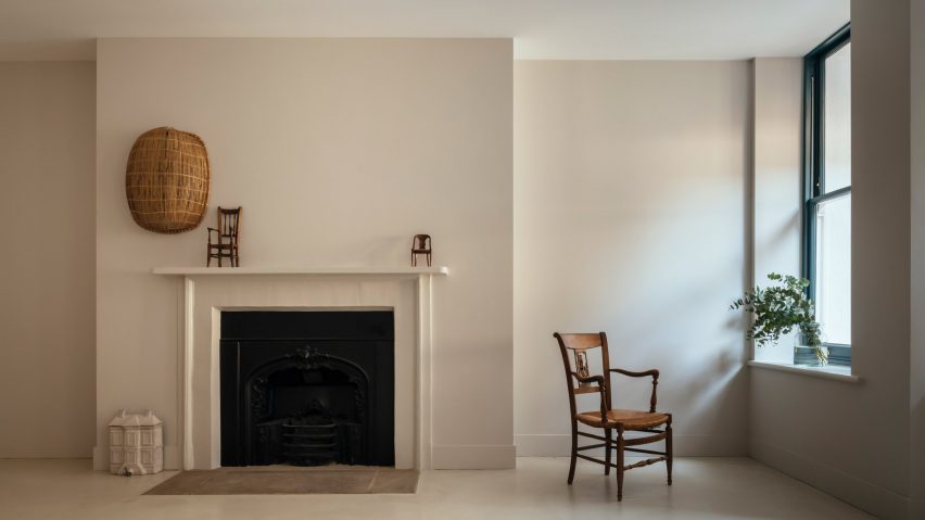 Lounge with fireplace in Unearthed Vault apartment by Daab Design