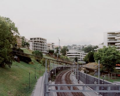 The apartment block is situated on a hill by DF_DC