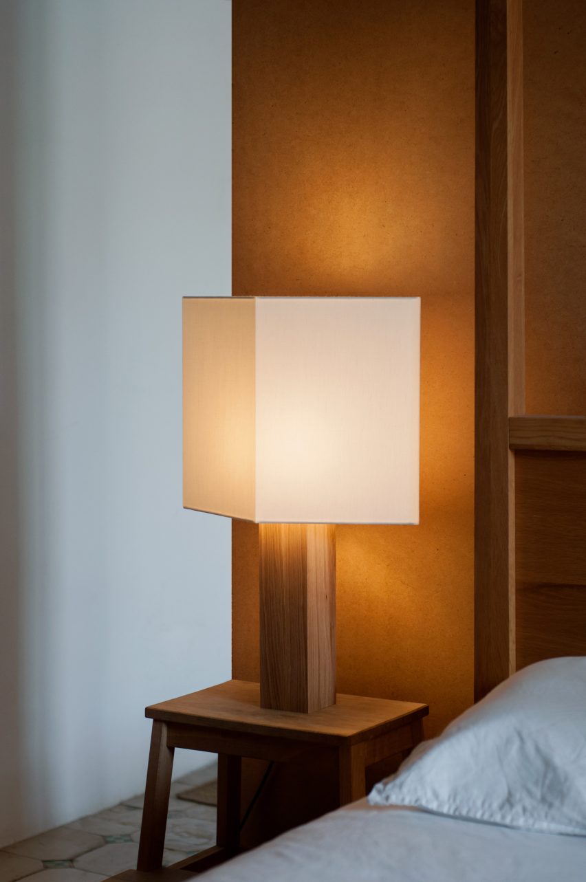 Oak and linen lamp by Gofi on a bedside table