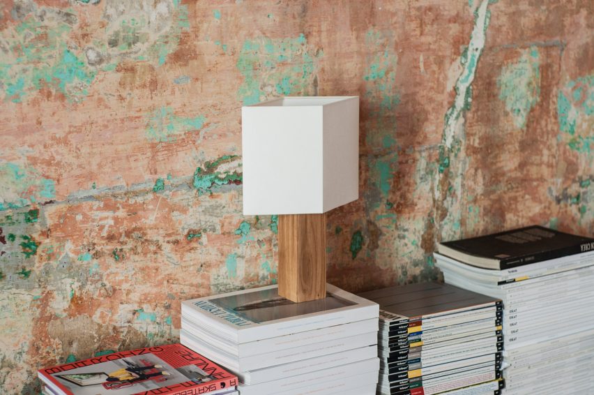 Chata lamp on a stack of magazines