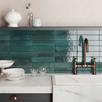 Turquoise tiled wall around a sink