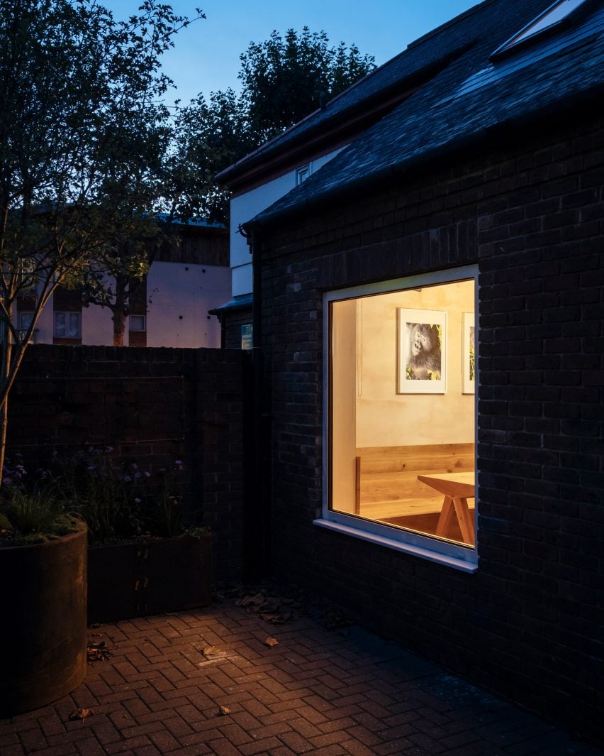 Large square window looking into a house