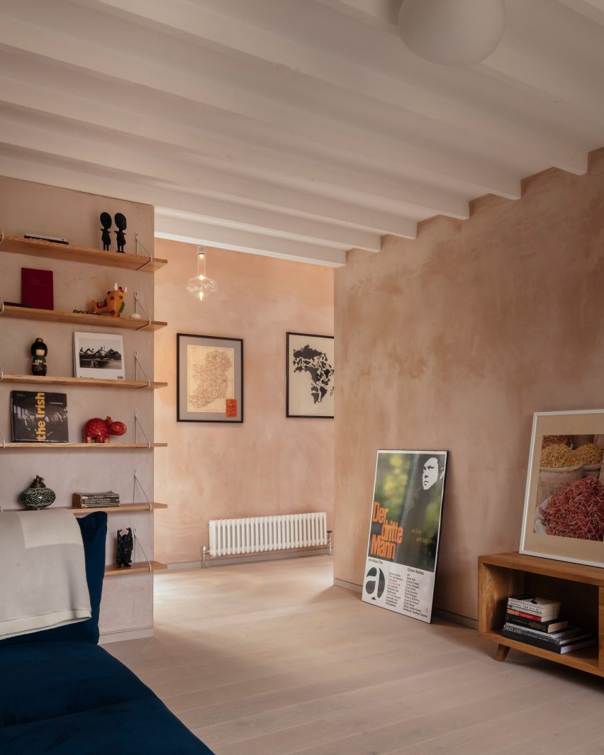 Exposed joists on a white painted ceiling in a living room