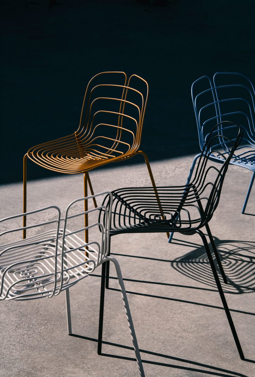 Four Wired chairs in white, black, blue and bronze
