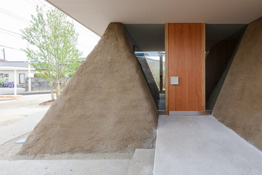 Trapezoid soil walls of house in Minamisoma