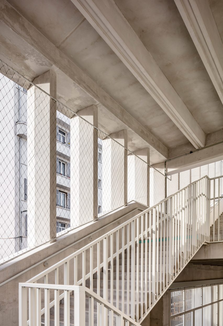A staircase winds between openings