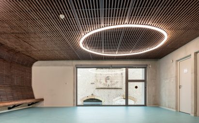 A blue floor and dark wood covers the interior