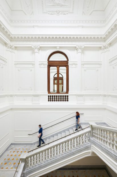 Decorative mouldings cover the walls and ceilings of Apple Via del Corso