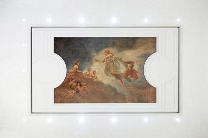 Lighting surrounds an original painting