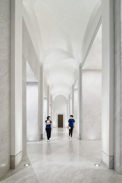 The corridor has a curved ceiling