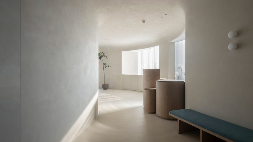 Windows are lined along the curved walls of Soul Realm SPA House by Atelier Right Hub