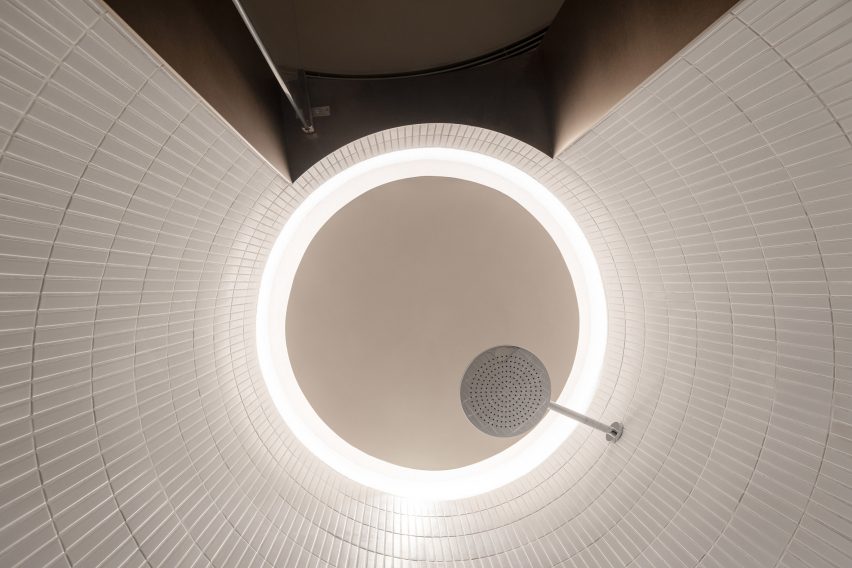Circular halo lighting was placed above the shower