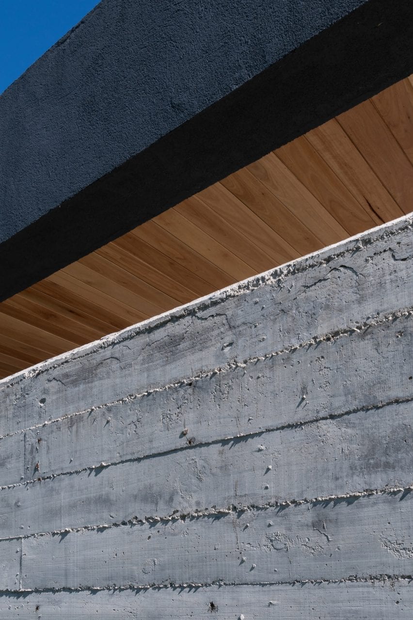 Concrete wall with timber ceiling