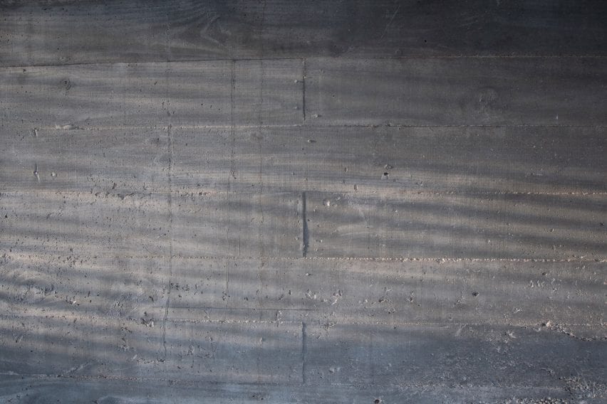 Sunlight strikes concrete wall