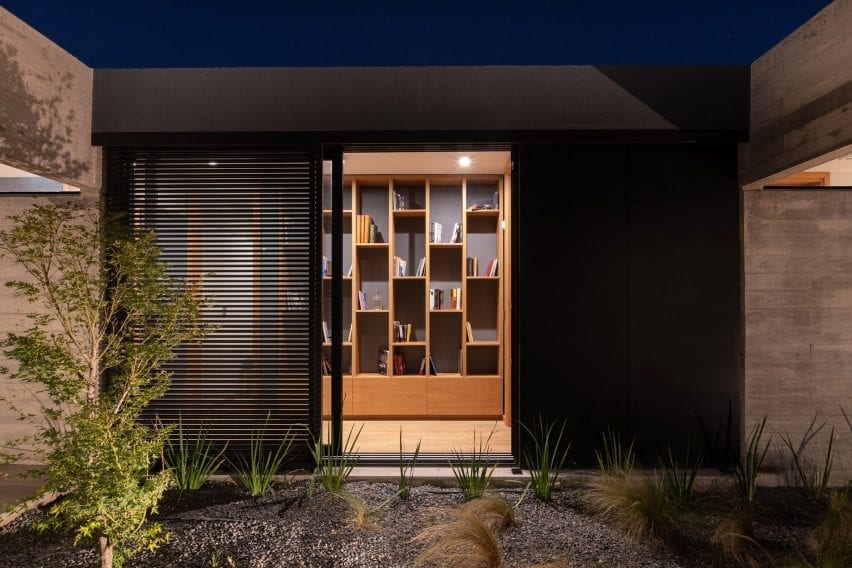 Built-in bookcase overlooking courtyard
