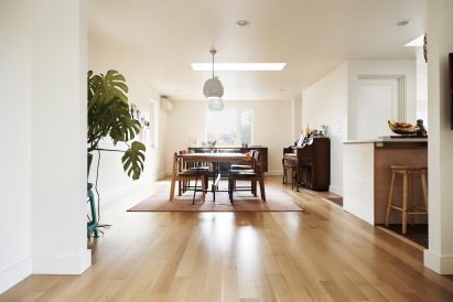 Neutral interiors contrast with darker cedar cladding