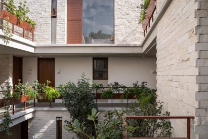 Plants define the "secret garden" within the building