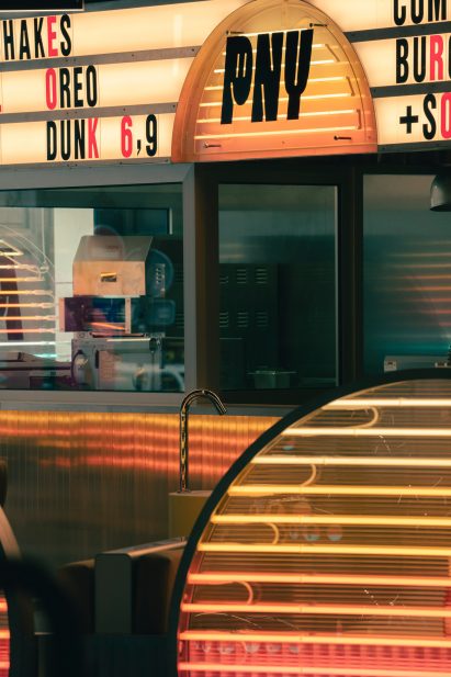 A PNY Citadium sign is located above the bar