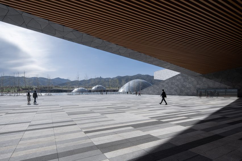 Buildings cantilever over areas
