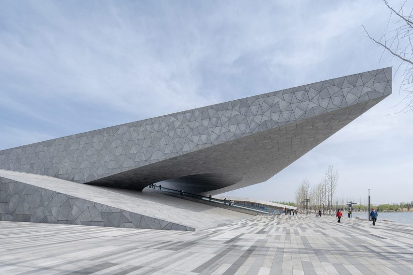 A stone building protrudes from the ground