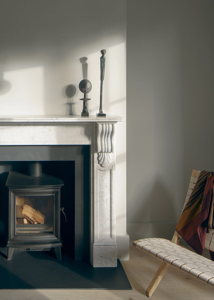 A log burner was fitted within a fireplace