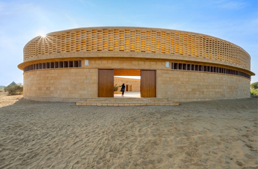 Wood doors mark the entrance to the school