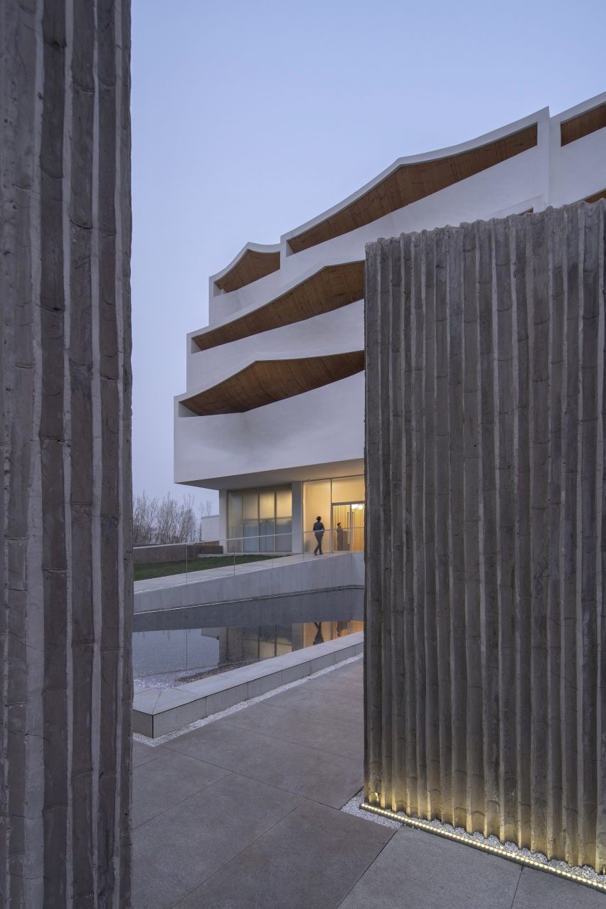 A pool is located at the front of the hotel