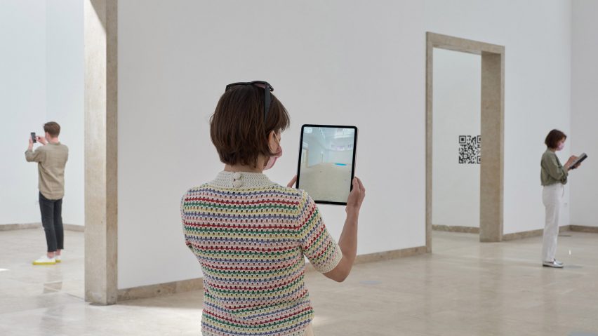 Visitor trying out QR code in German pavilion