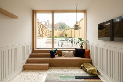 A floor-to-ceiling glass door to a reargarden
