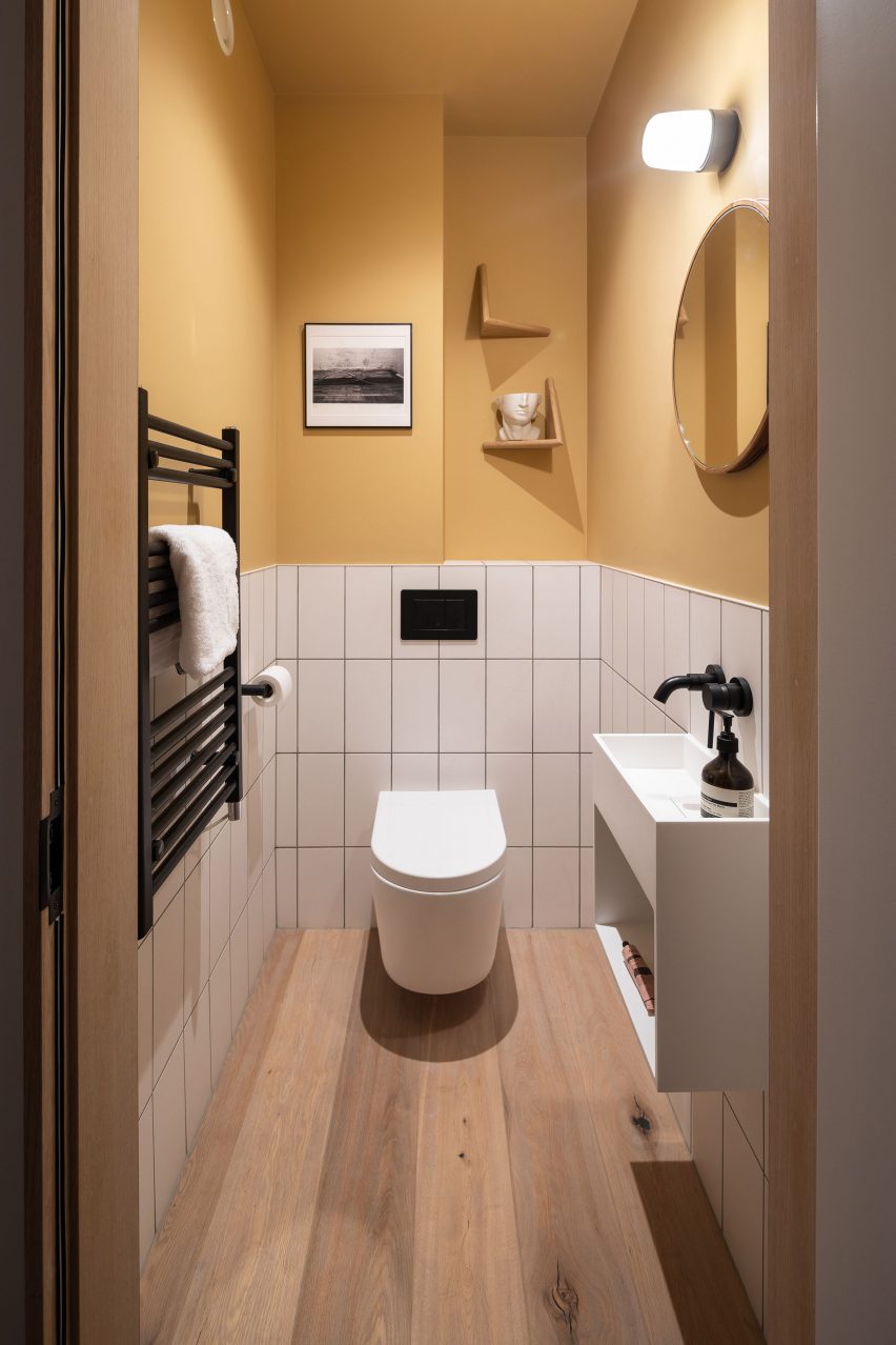 A white and yellow bathroom