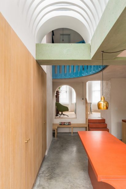 A green beam crosses the ceiling of Recast House