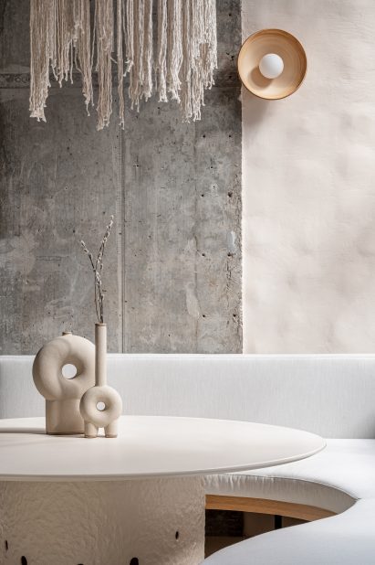 Found vases and seating nook in Kyiv restaurant by Yakusha Design
