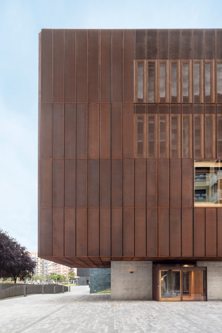 Perforated steel conceals windows