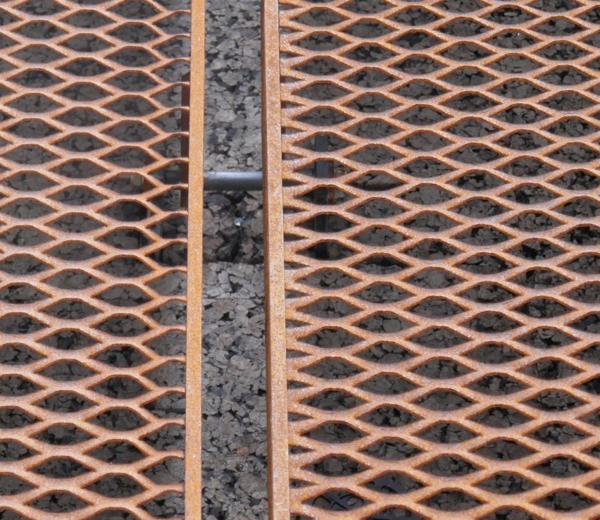 The building is wrapped in a steel mesh