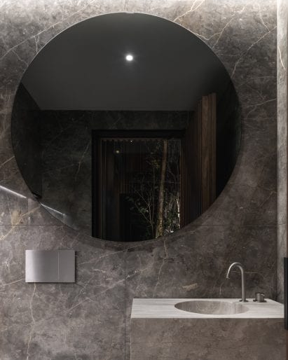 Travertine was used for custom-milled bathroom sinks