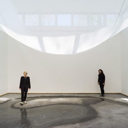 A sheet drapes across the interior of the Danish Pavilion
