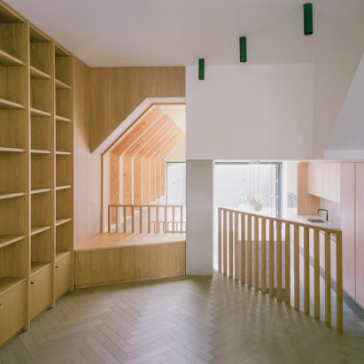 Matthew Giles Architects uses cranked beams to frame views through London terraced house