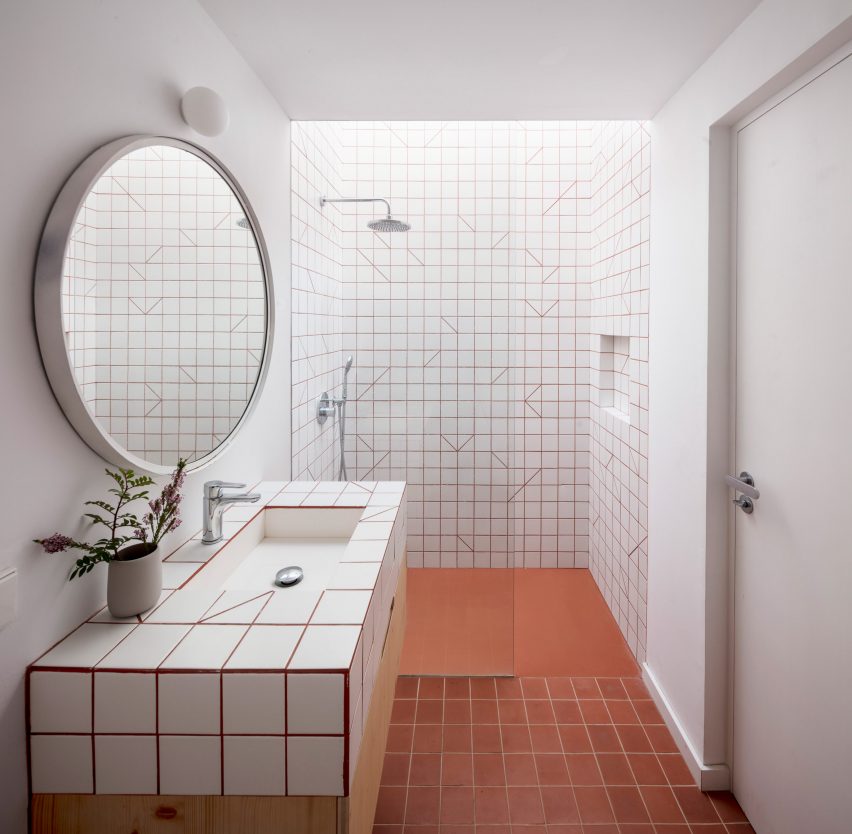 Square tiles cover the walls and floors